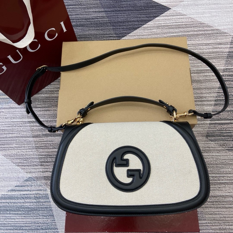 G*u*i top handle bags